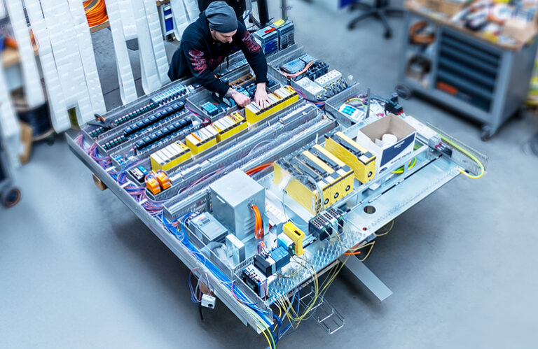 Wiring and control unit installation at specially equipped workstations.