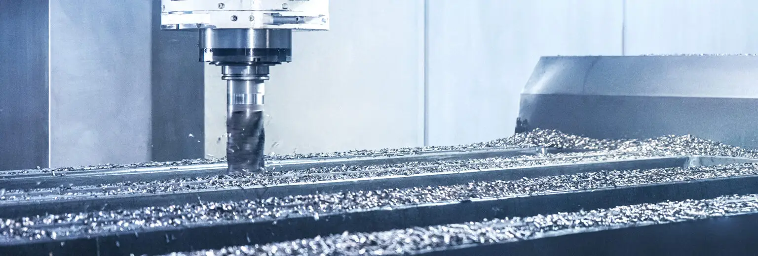CNC milling machine performs machining on a large component – precision milling for machine bases and base bodies
