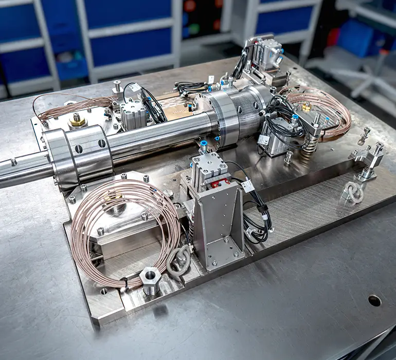 Clamping device assembly for an ECM machine: Complex assembly featuring hydraulic, pneumatic, and electrical components.